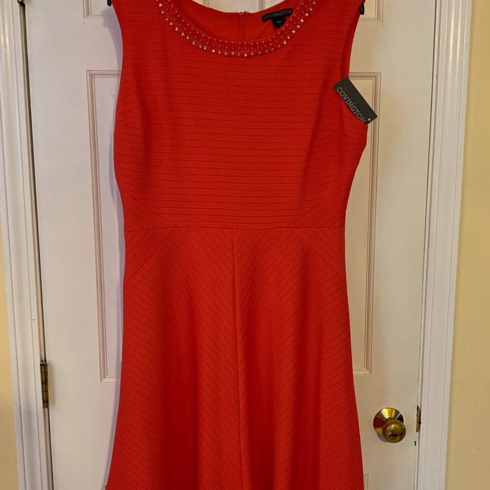 Orange sleeveless flare dress by Covington. New with tags.